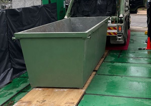 Timber protection boards for skip bins in driveways