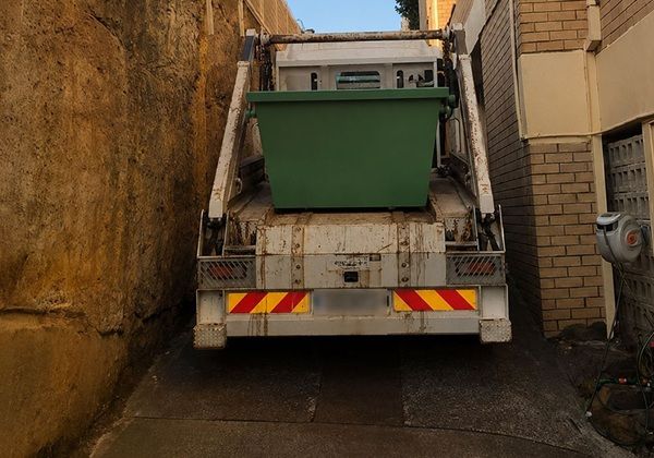 narrow lane way skip delivery